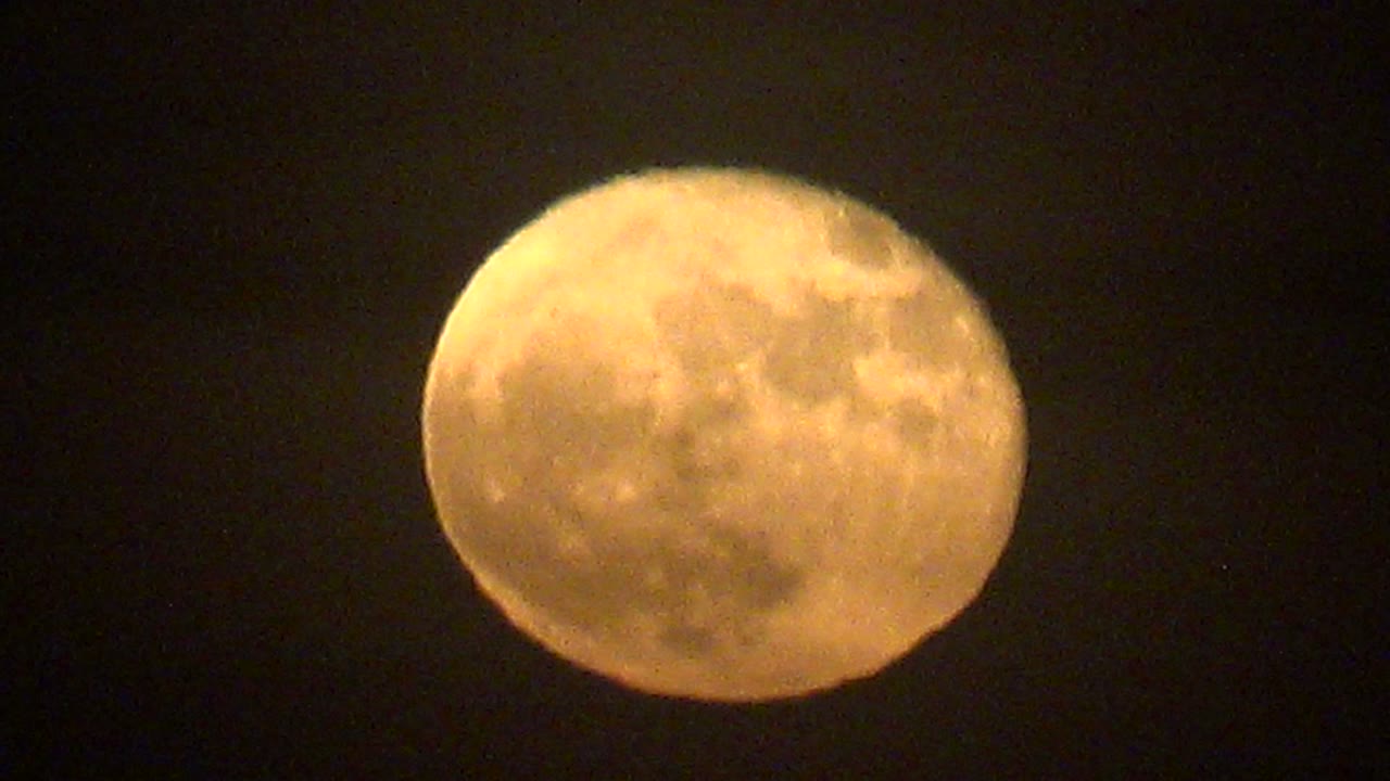At the start of the La Bocana clip, a warm full moon sits high against a dark night sky with softened surface detail and no visible people.