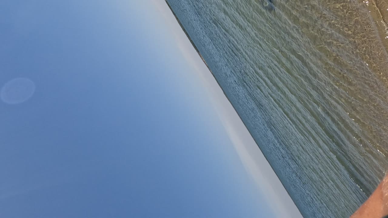 Diagonal ocean water and sandy shallows