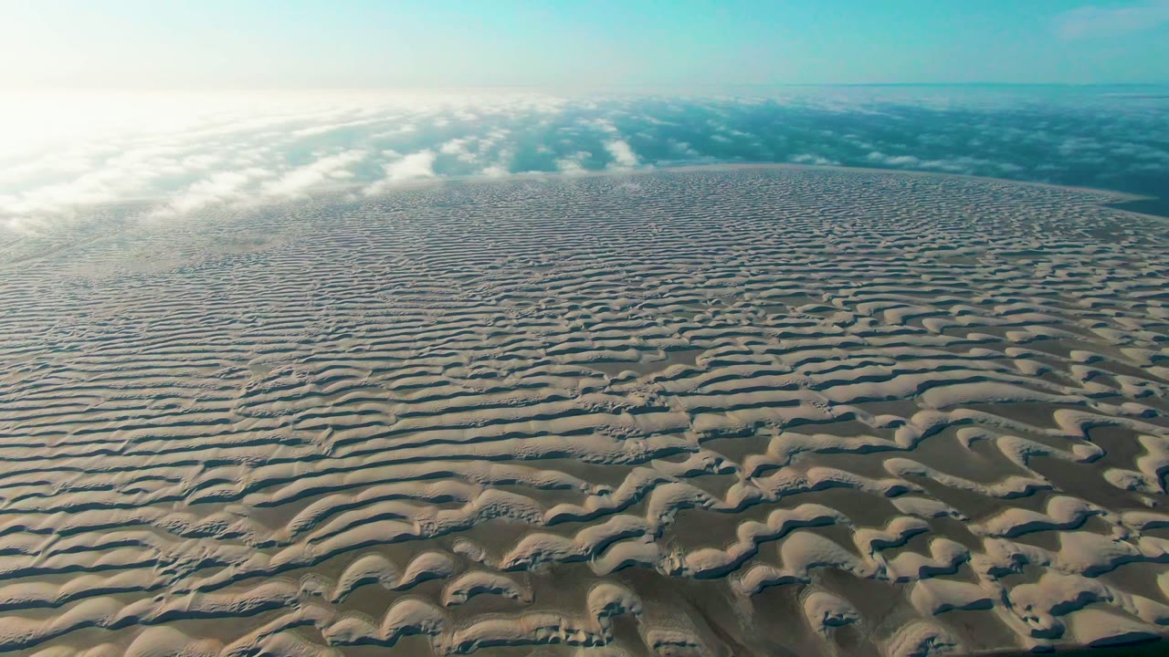 Wide aerial dune field with repeating sand ripples