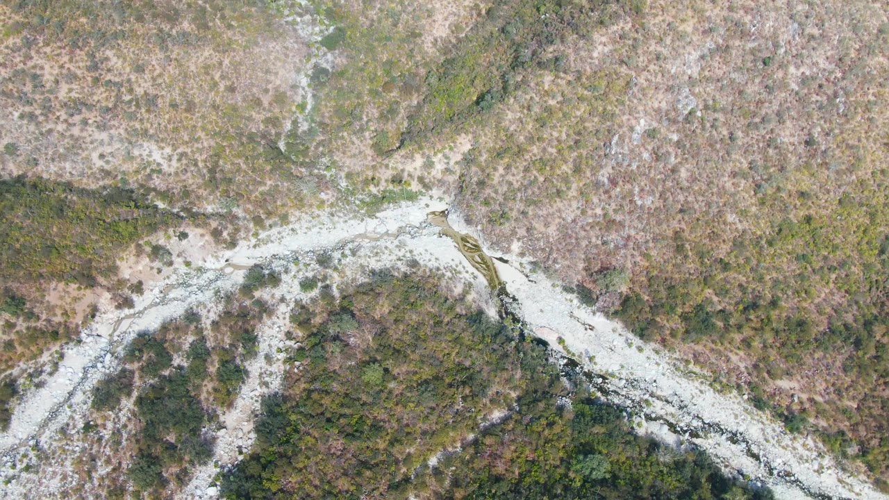 Overhead mountain road crossing scrubby hills