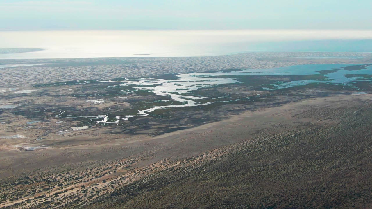 Wide aerial landscape of wetland channels and sandy flats