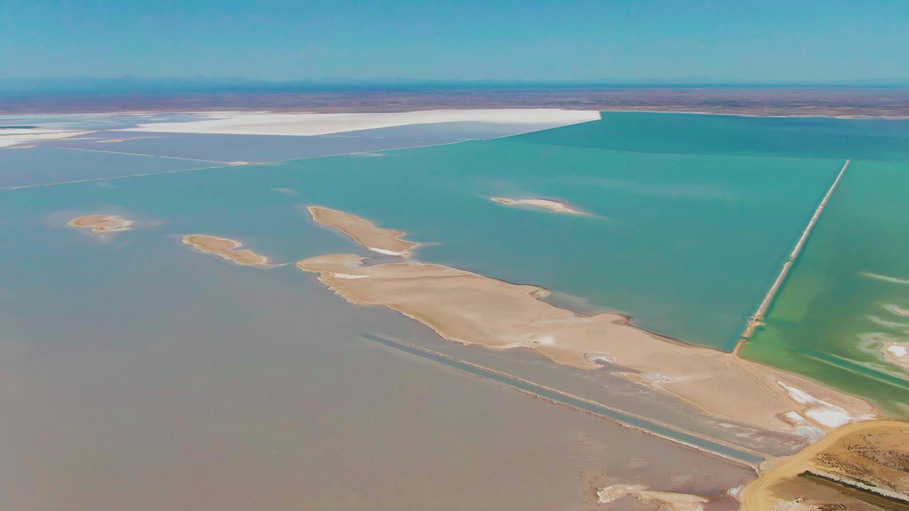Salt evaporation ponds with sand bars and a long levee