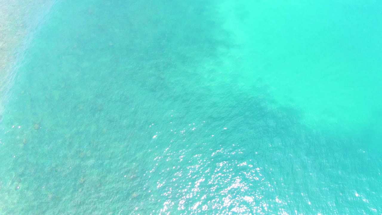 Clear aqua water with brighter surface sparkle