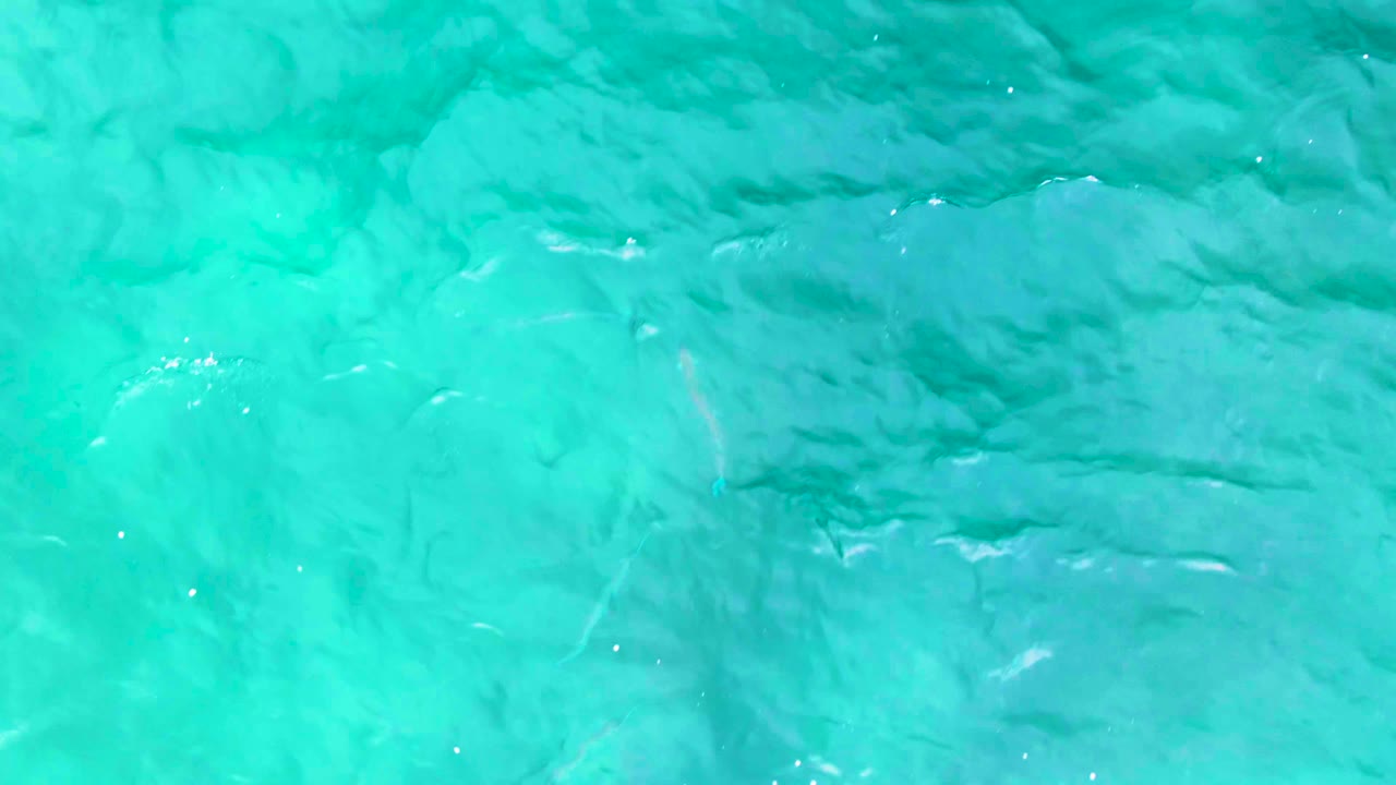 Turquoise ocean water with gentle surface ripples