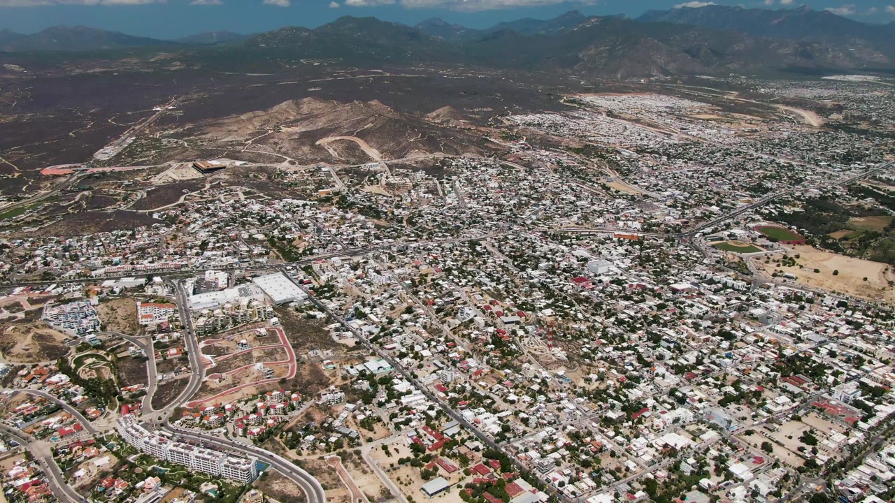 Aerial town panorama under darker cloud cover.