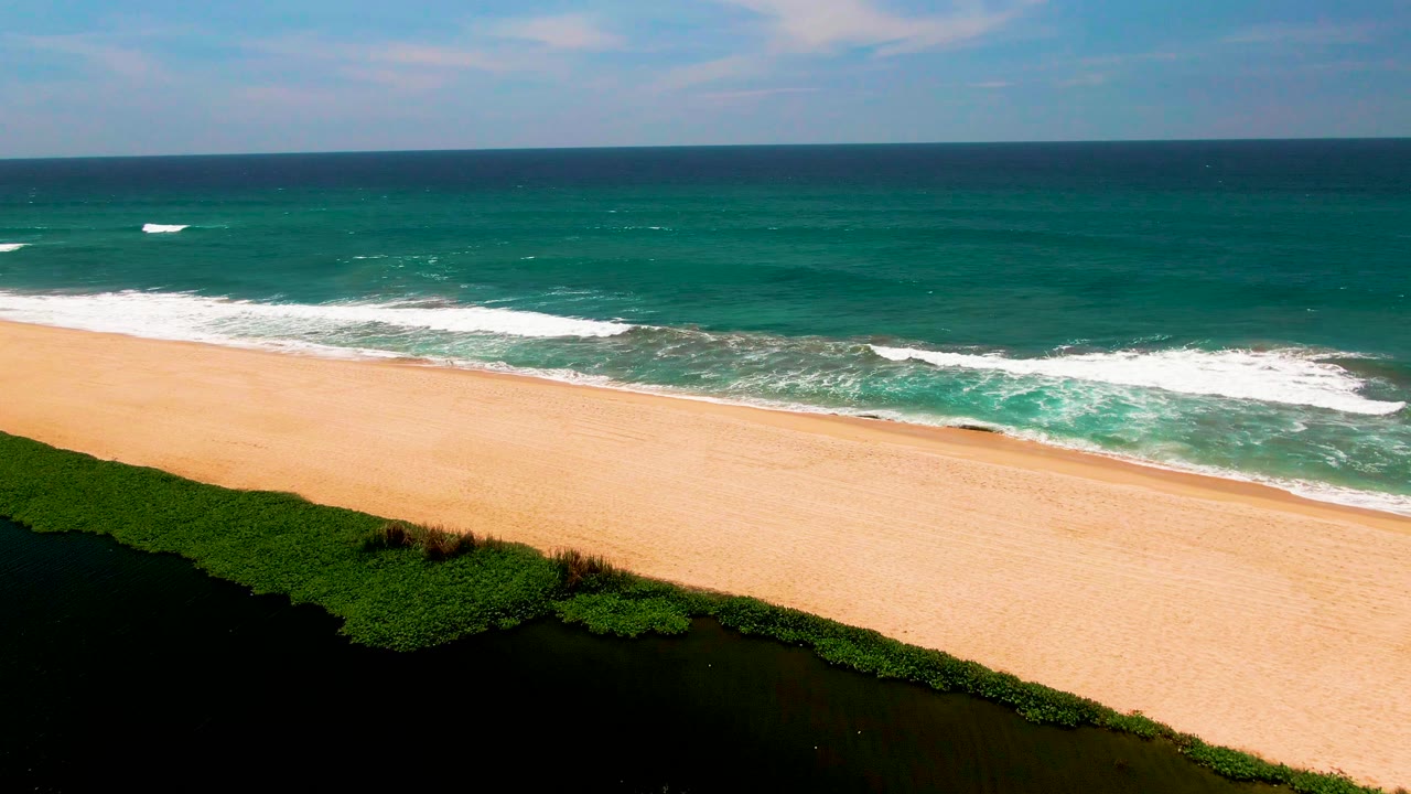 Aerial beach view with less lagoon and more ocean surf