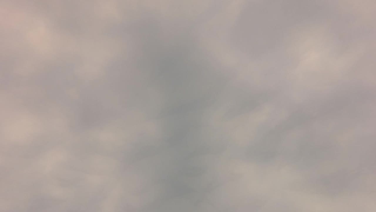 Blurred light gray water surface with soft ripples