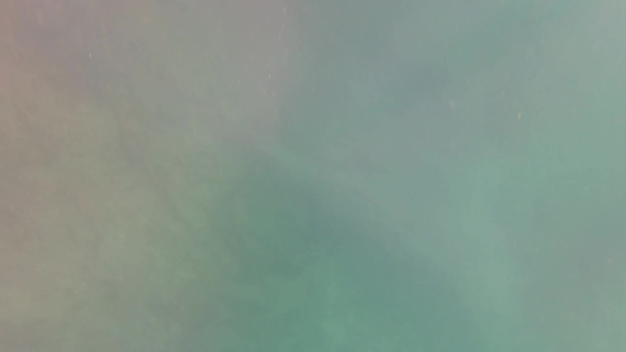 Close view of turquoise pool water with muted ripples.