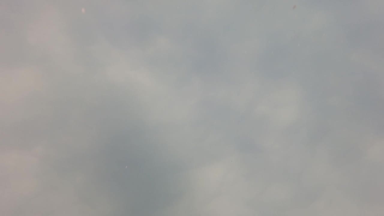 A blurred overcast sky fills the third frame from San Jose Del Cabo, with rounded gray cloud patches and no visible people, structures, or text.