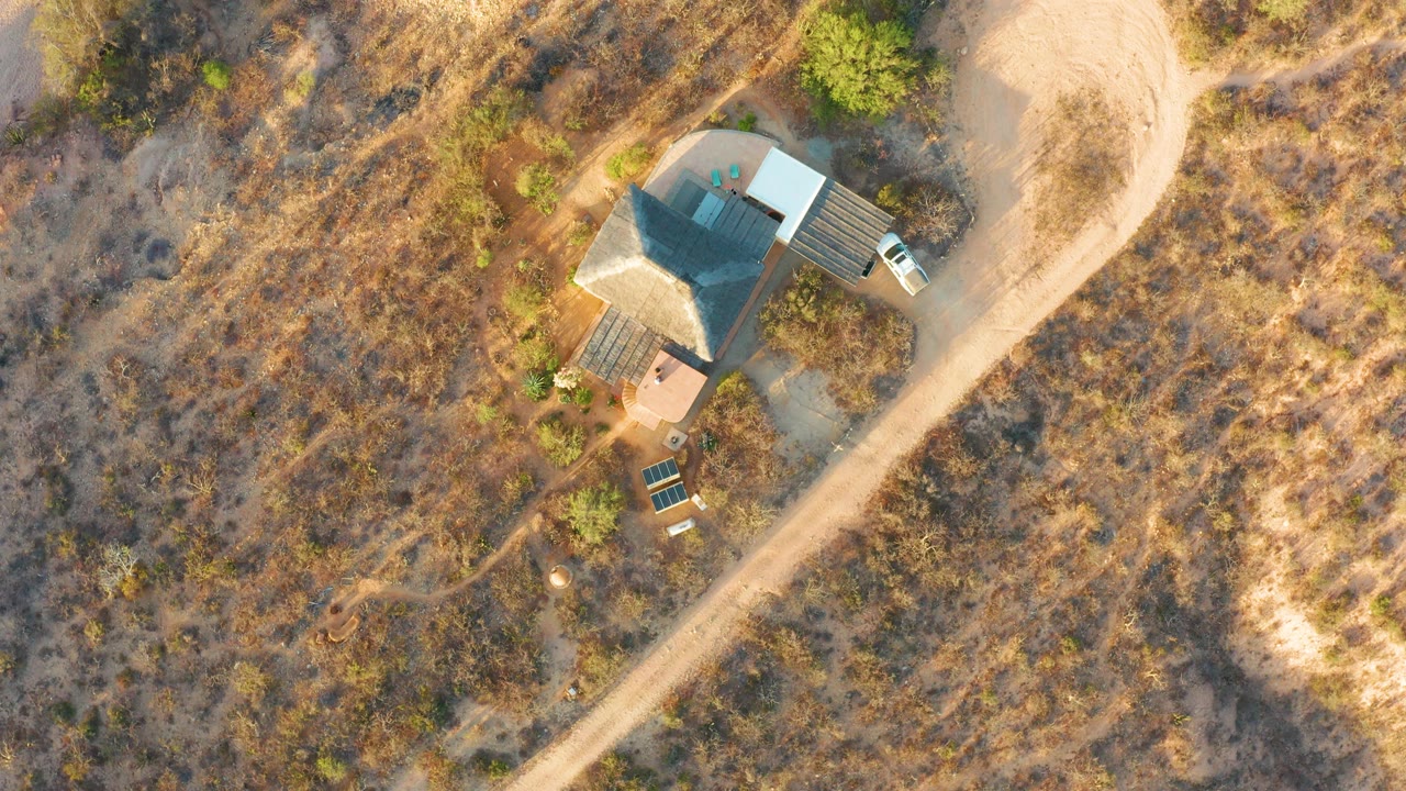 Overhead view of the house with the roof beginning to appear lighter.