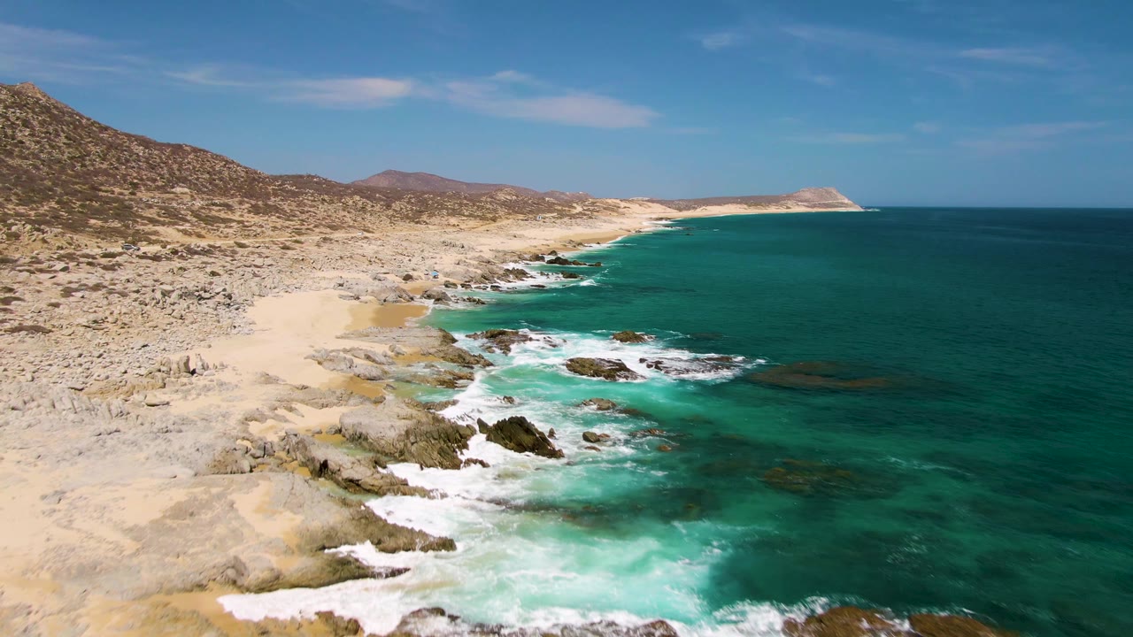Aerial view of rocky beach and turquoise ocean
