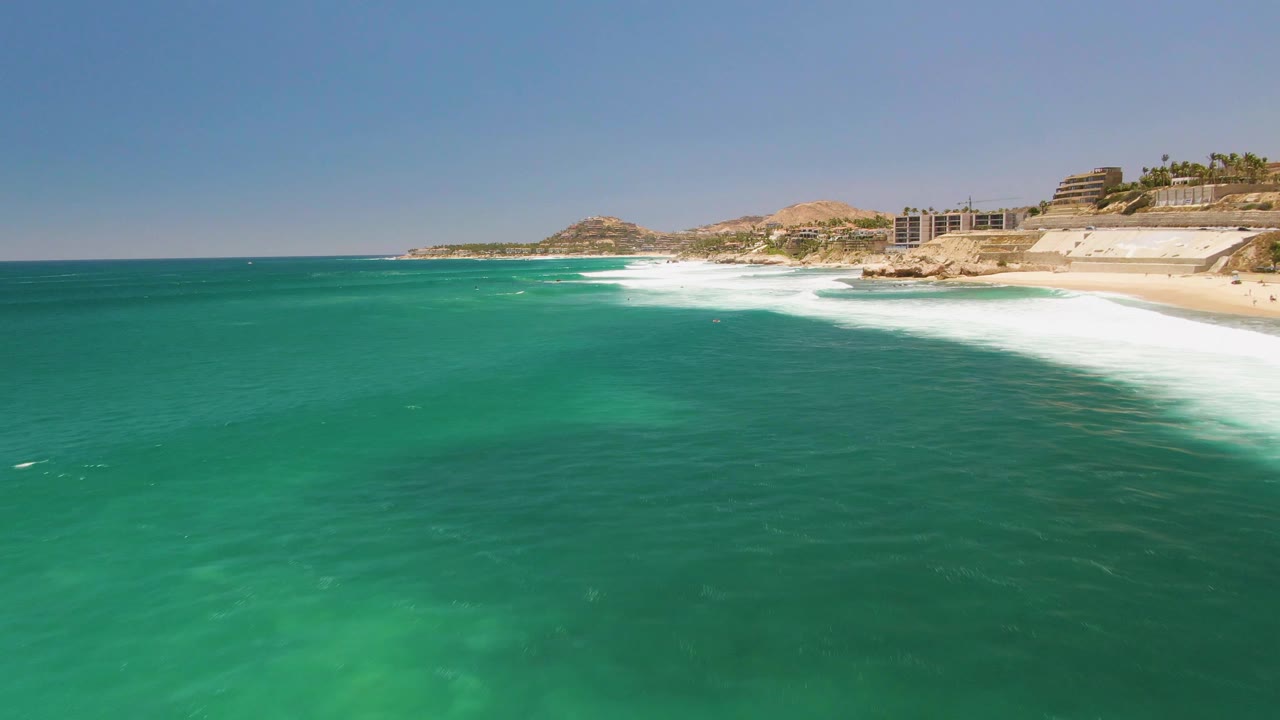 Open ocean foreground with waves breaking near shore