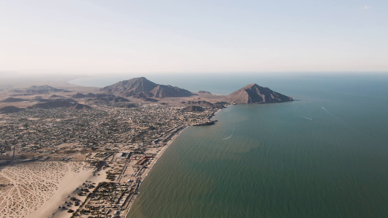 Wide aerial of San Felipe bay with mountains beyond town