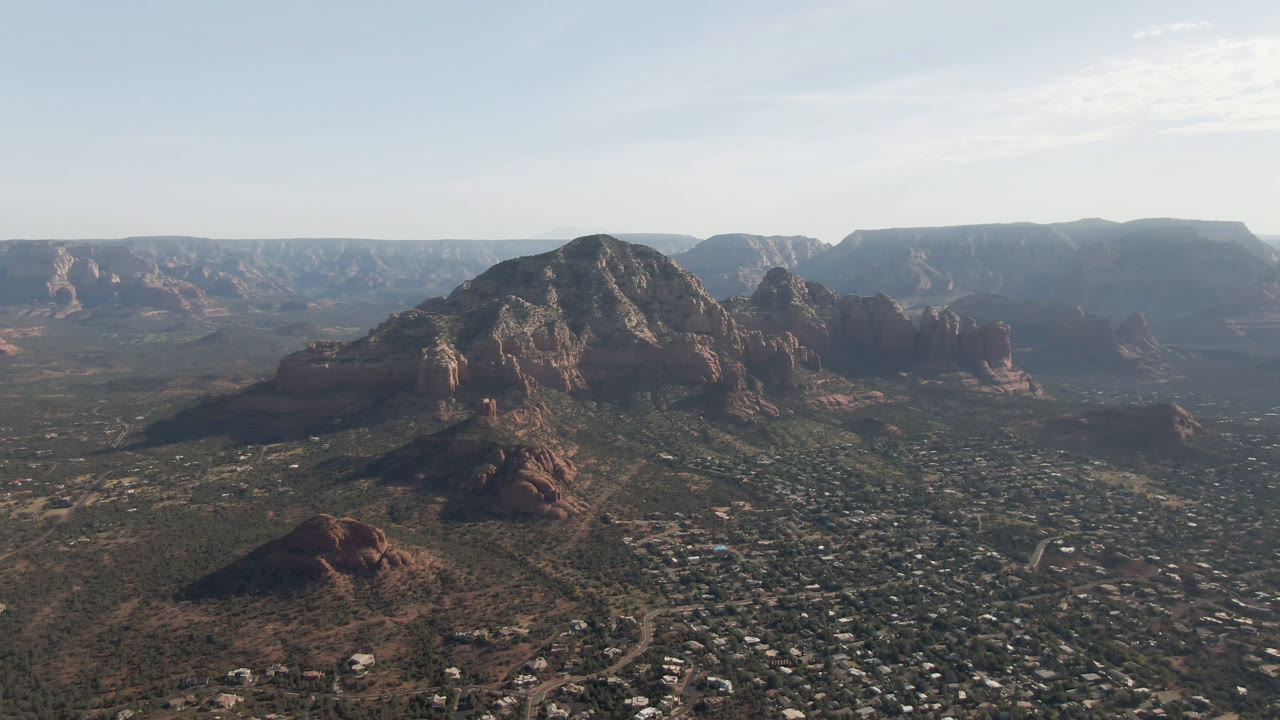 Red rock ridge and valley seen from high above.
