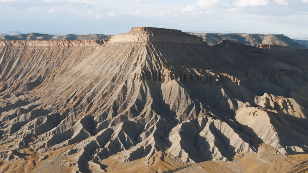 Flat-topped mesa with shadowed ravines