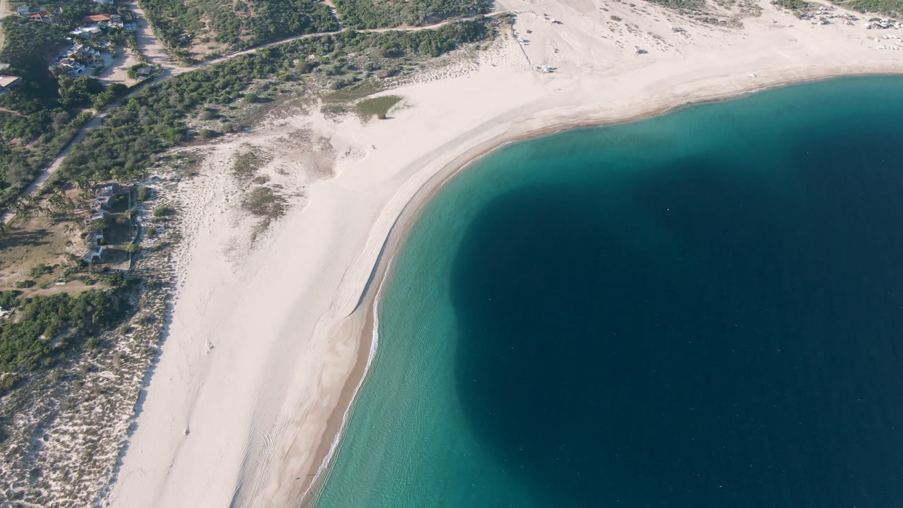 Drone view of sandy coast and deep blue water at Los Frailes.