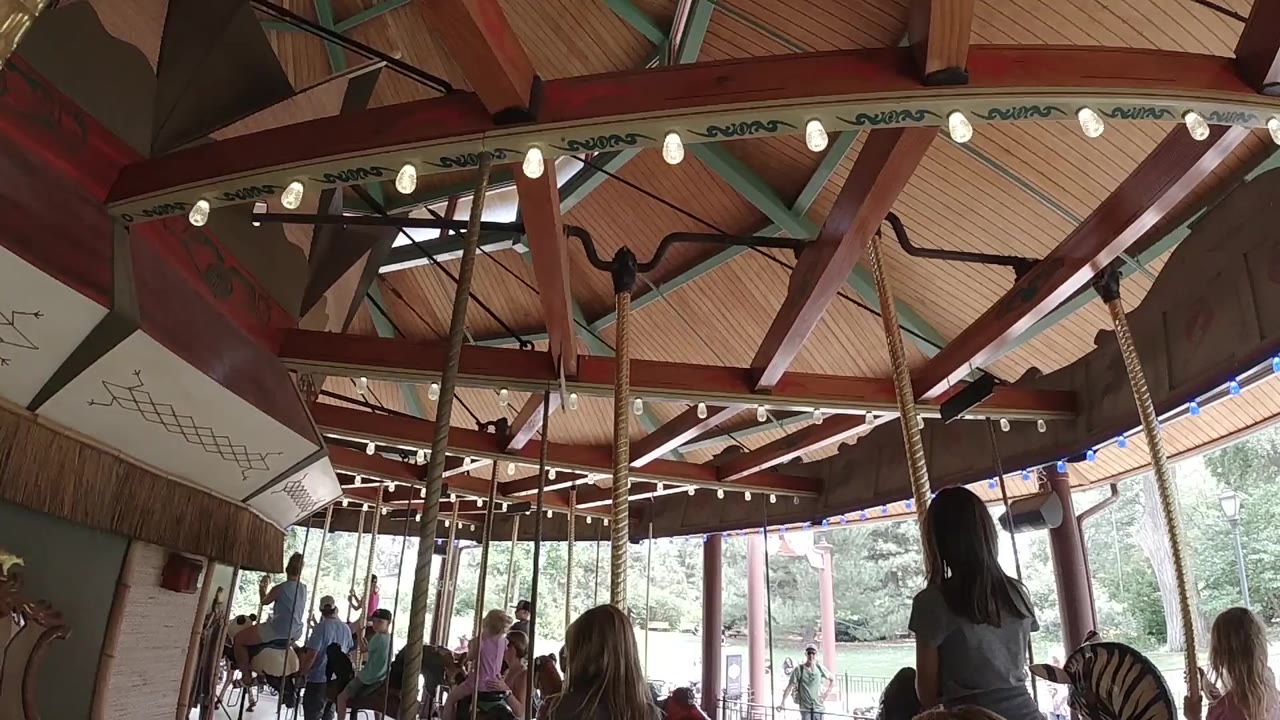 Carousel roof beams and silhouetted riders