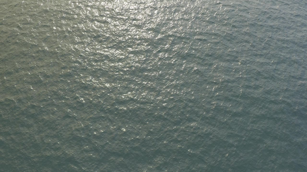 Sunlight reflecting on rippled ocean water