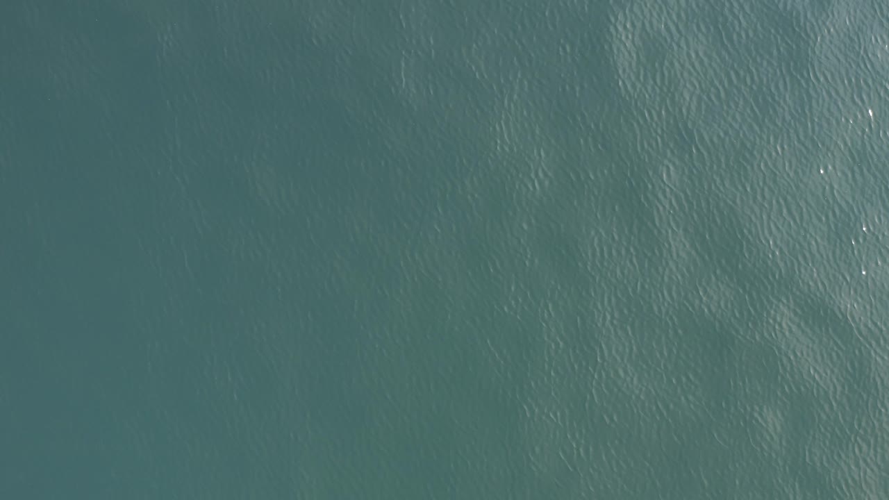 Top-down turquoise ocean water with fine ripples