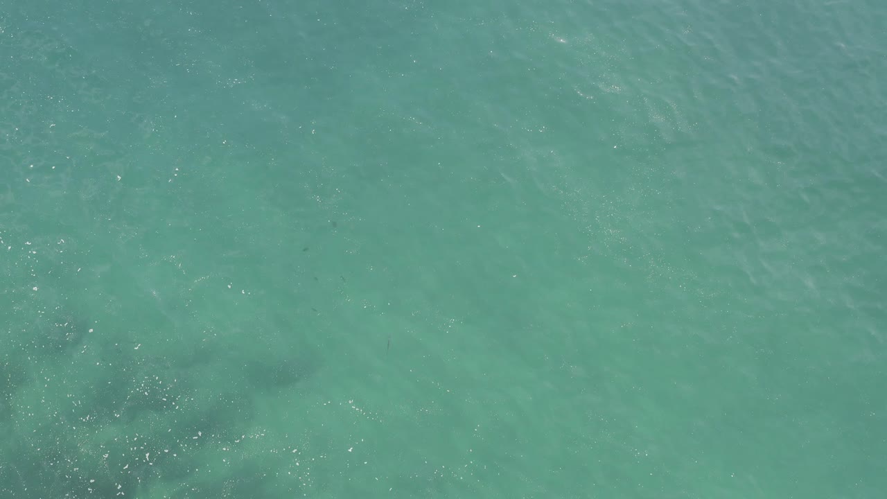 Turquoise ocean water seen from directly above