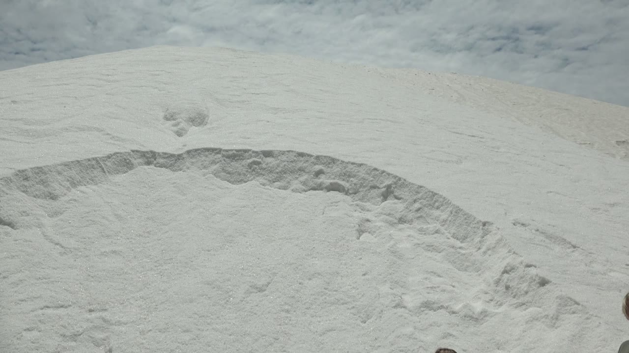 White sand dune in Guerrero Negro BCS Mexico with a curved textured depression across the lower half and no visible people.