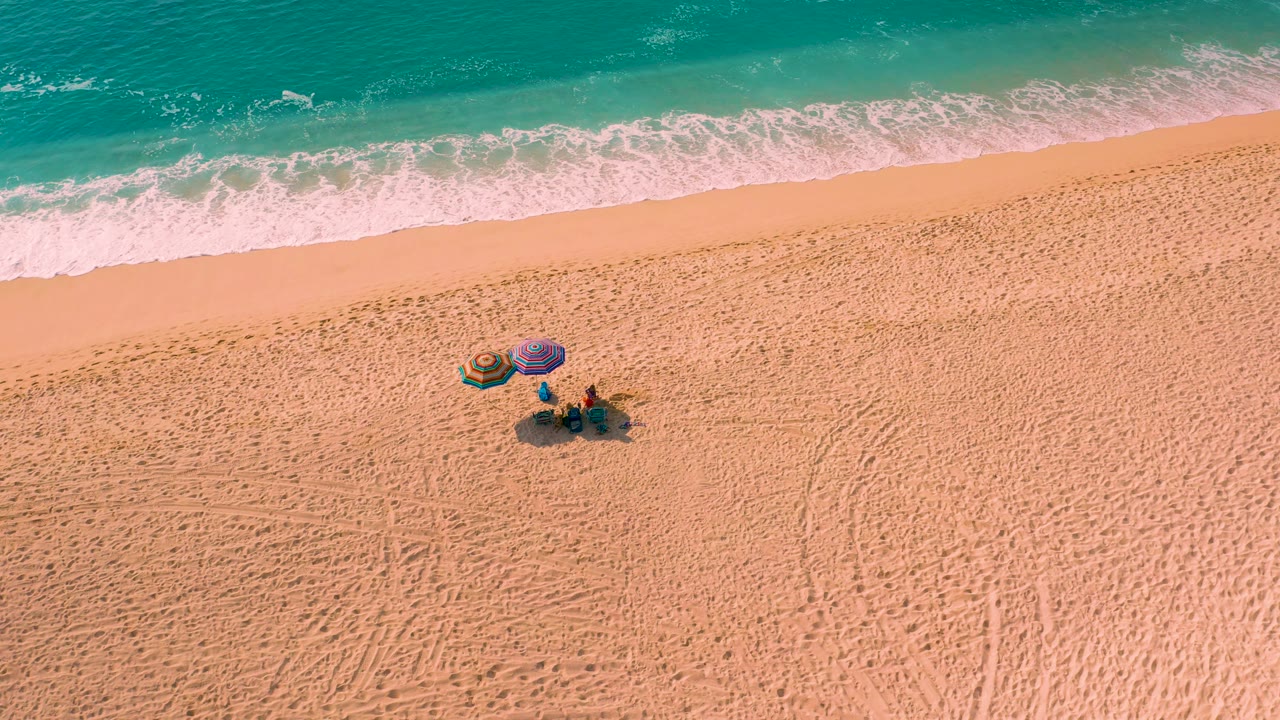 High-angle view in Desert Park Natural Reserve, Baja California Sur, showing the beach setup farther from the left edge while the surf band continues across the top.