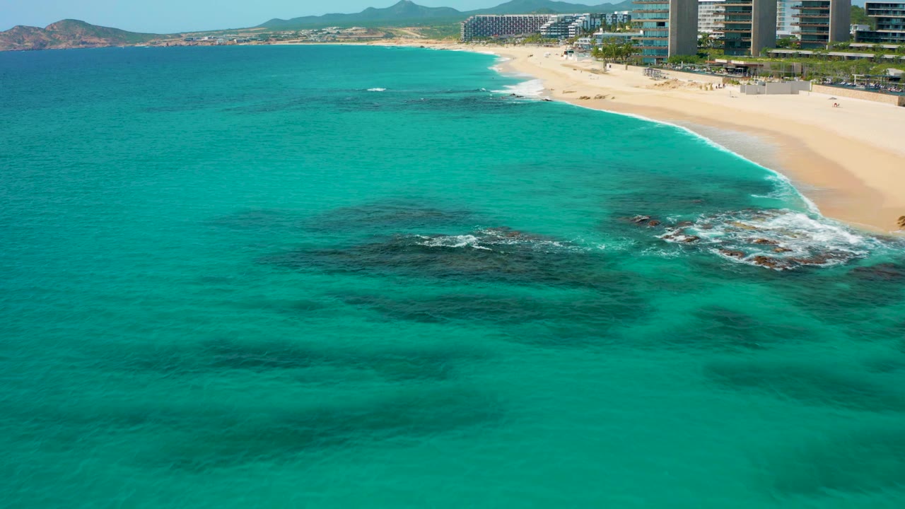 Aerial coastline with turquoise water and beach hotels