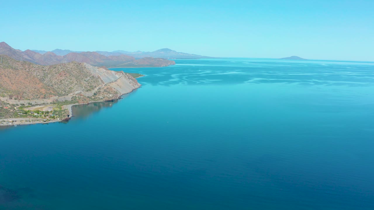 Aerial view of mountain shoreline and open sea