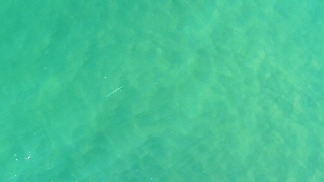 Clear green-turquoise water in Campestre San Jose Del Cabo BCS Mexico shows subtle sandy bottom detail under shifting surface light and no visible people.