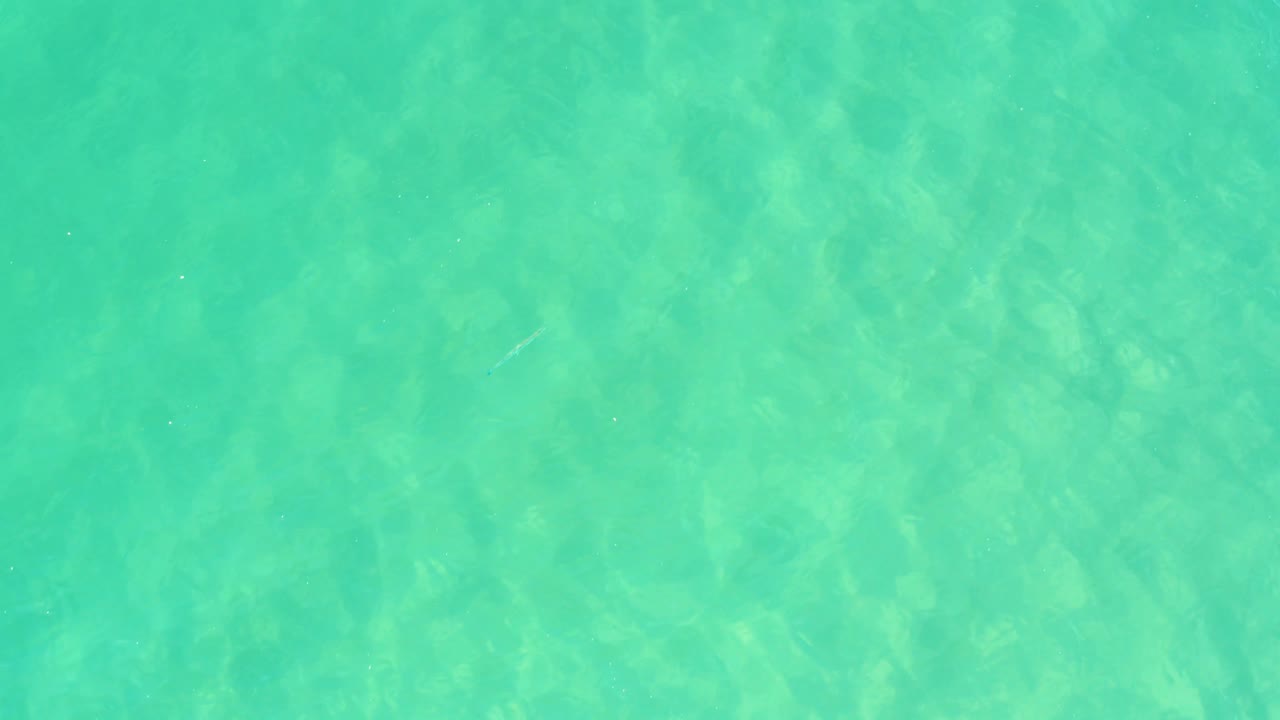 Overhead green-turquoise water from Campestre San Jose Del Cabo BCS Mexico, showing soft ripples and mottled light across the surface with no visible people.