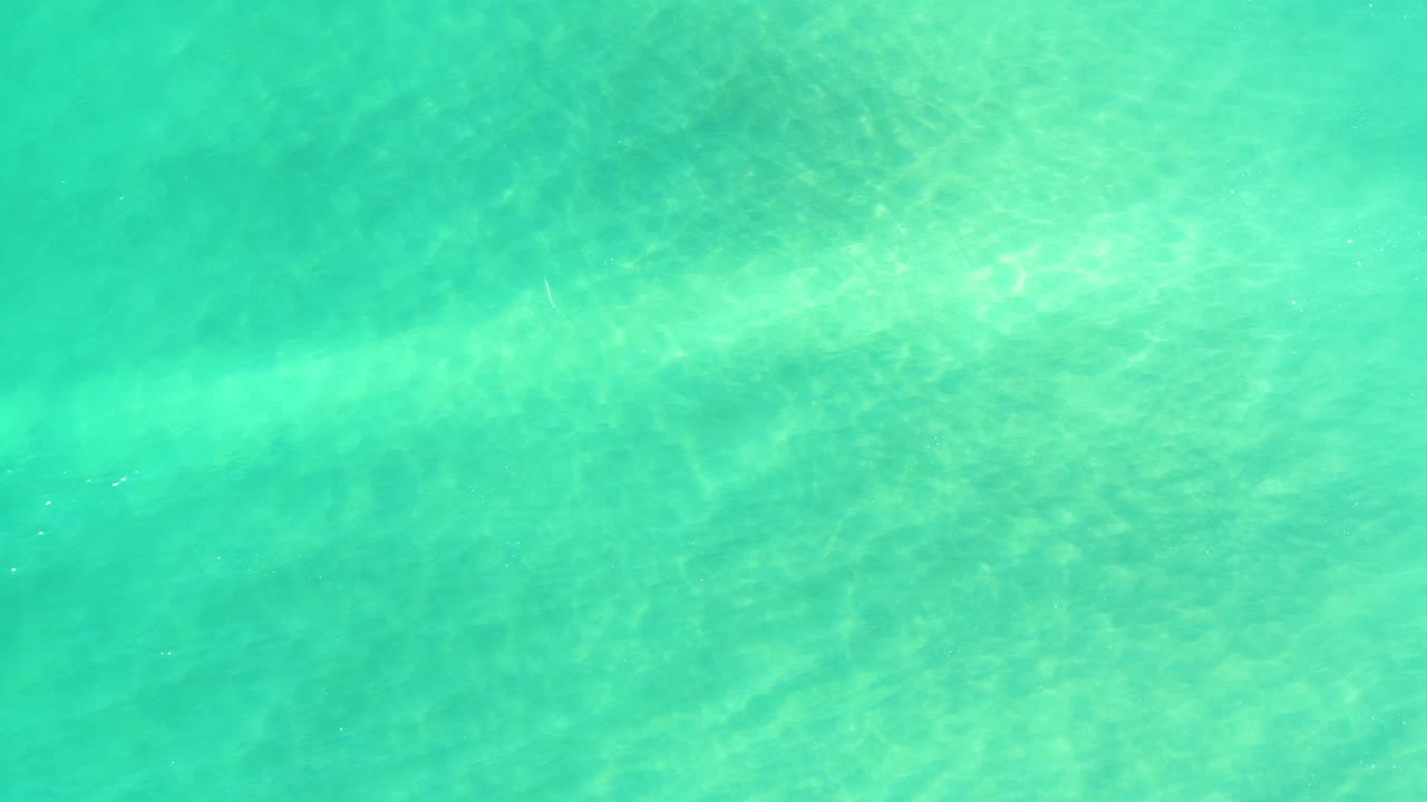 Clear turquoise ocean water over a visible sandy seabed in Campestre San Jose Del Cabo BCS Mexico, with no visible people.