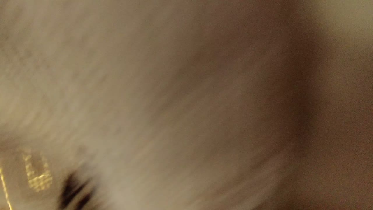Blurred pale ceiling and wall detail
