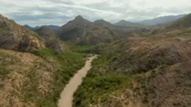 CABO PULMO BCS MEXICO-2024: Dirt Road Winding Through A Valley