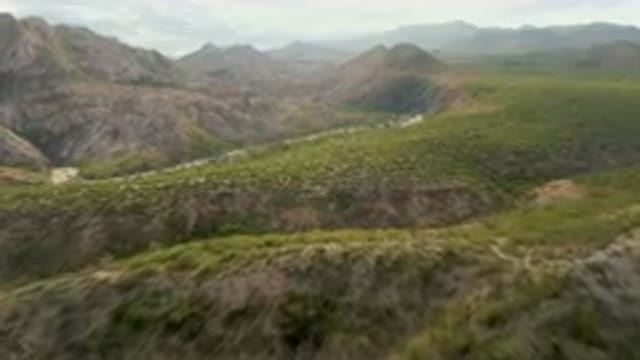CABO PULMO BCS MEXICO-2024: Winding Road In The Mountains With A Mountain In The Background