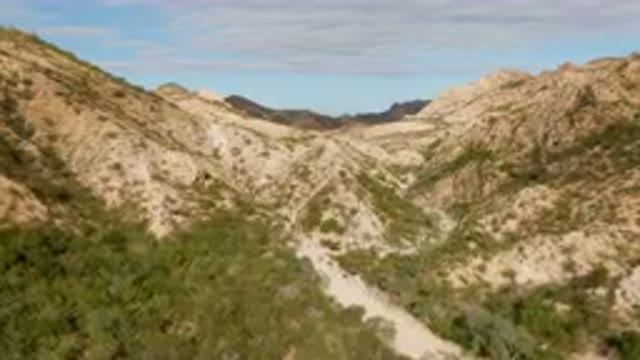 CABO PULMO BCS MEXICO-2024: Dirt Road Going Through A Canyon In The Mountains