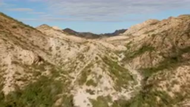 CABO PULMO BCS MEXICO-2024: Train Traveling Through a Mountain Valley