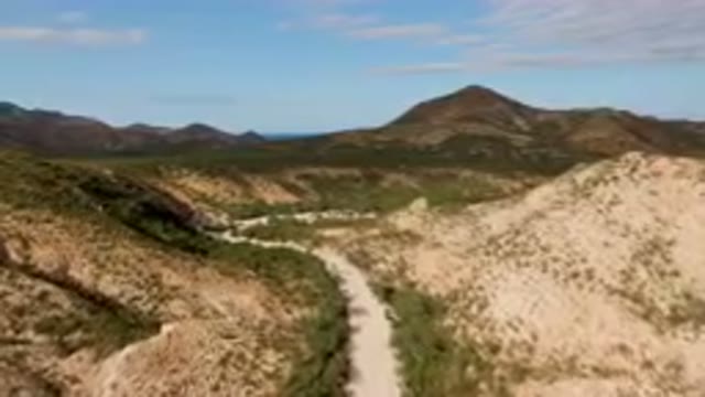 CABO PULMO BCS MEXICO-2024: Dirt Road Going Through A Valley In The Mountains
