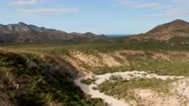 CABO PULMO BCS MEXICO-2024: Mountains And A Dirt Road In The Middle Of A Desert