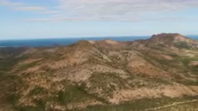 CABO PULMO BCS MEXICO-2024: Mountains With A View Of The Ocean And A Blue Sky