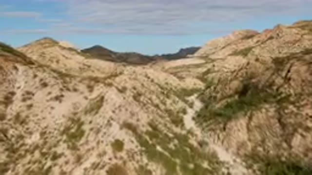 CABO PULMO BCS MEXICO-2024: Dirt Road Going Through A Canyon In The Mountains