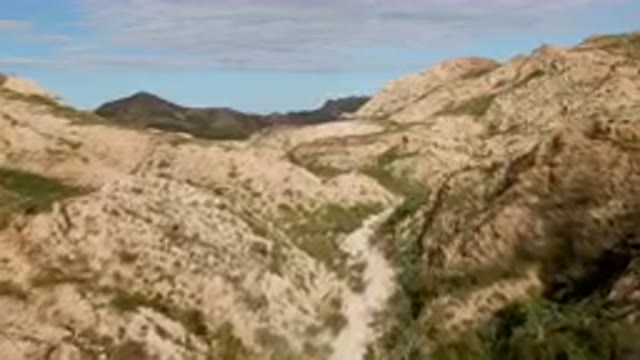 CABO PULMO BCS MEXICO-2024: Dirt Road Going Through A Canyon In The Mountains