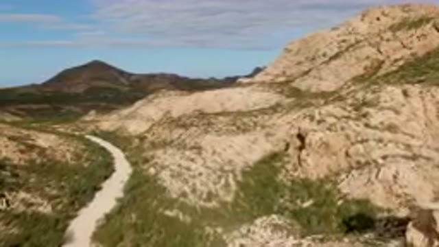 CABO PULMO BCS MEXICO-2024: Dirt Road Going Through A Mountain With A Mountain