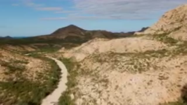 CABO PULMO BCS MEXICO-2024: Dirt Road Going Through A Valley In The Mountains