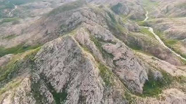 CABO PULMO BCS MEXICO-2024: Aerial View of a Winding Road Through Rocky Hills