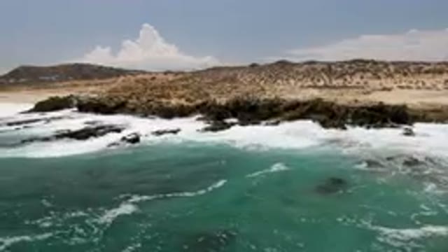 LAGUNA BEACH EAST CAPE BCS MEXICO-2023: Man Riding A Surfboard On The Ocean