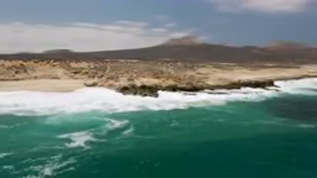 LAGUNA BEACH EAST CAPE BCS MEXICO-2023: Man Riding A Surfboard On The Ocean