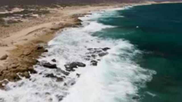 LAGUNA BEACH EAST CAPE BCS MEXICO-2023: Beach With Waves Crashing On The Rocks