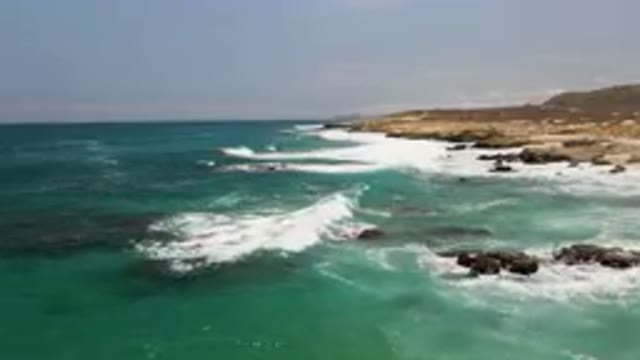 LAGUNA BEACH EAST CAPE BCS MEXICO-2023: Waves Crashing On Rocks Near The Ocean