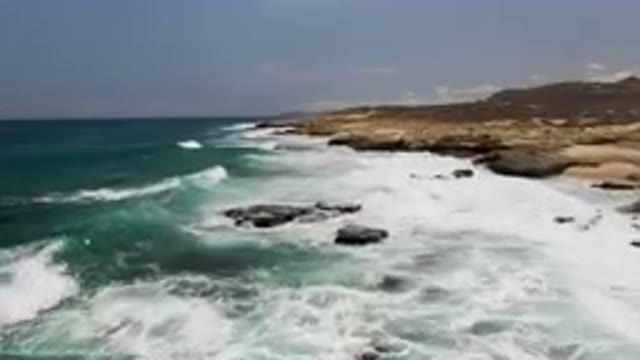 LAGUNA BEACH EAST CAPE BCS MEXICO-2023: Man Standing On A Rock Cliff Overlooking