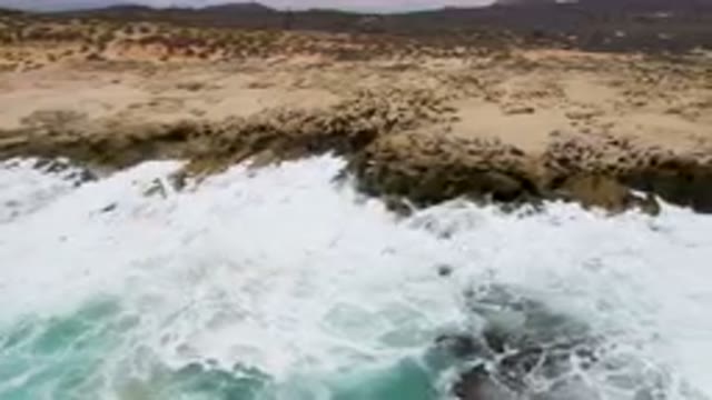 LAGUNA BEACH EAST CAPE BCS MEXICO-2023: Man Riding A Surfboard On A Wave In The